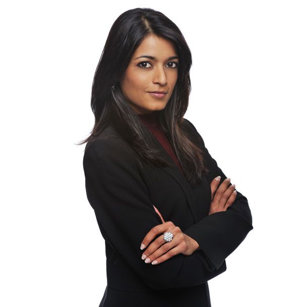 A LADY FOLDING HAND AND STARING AT YOU