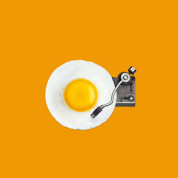 A SUNNY SIDE UP EGG WITH A GRAMAPHONE PLUG